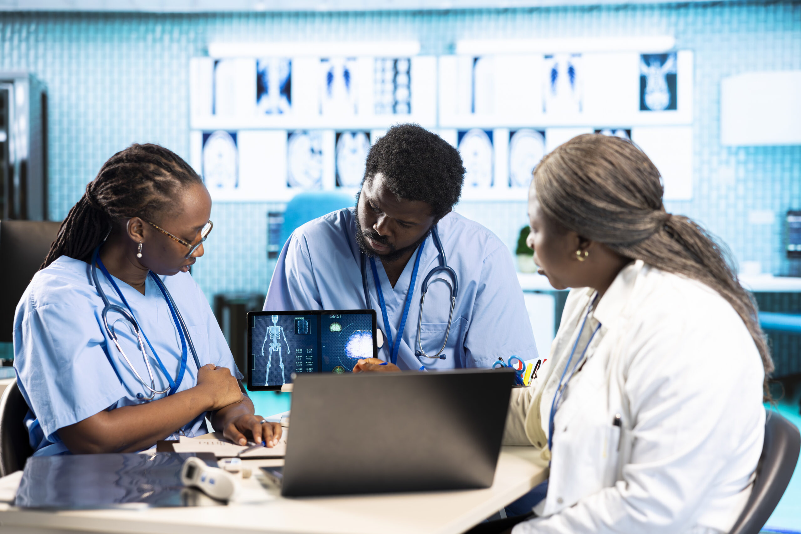 male and female african american medical staff discussing diagnostic results